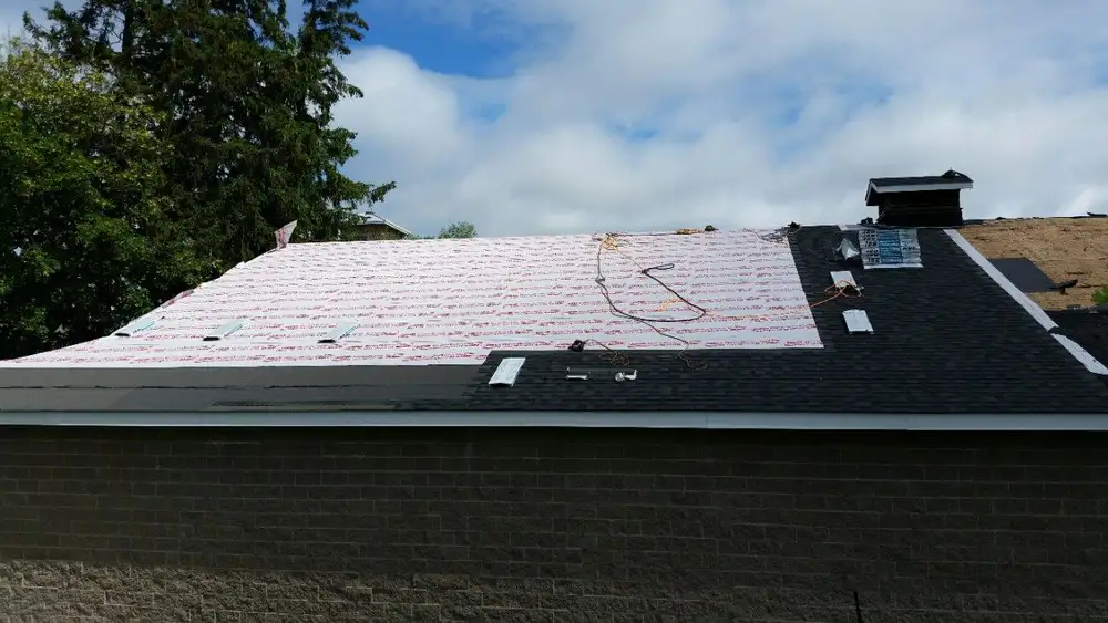Sloped roof replacement in progress